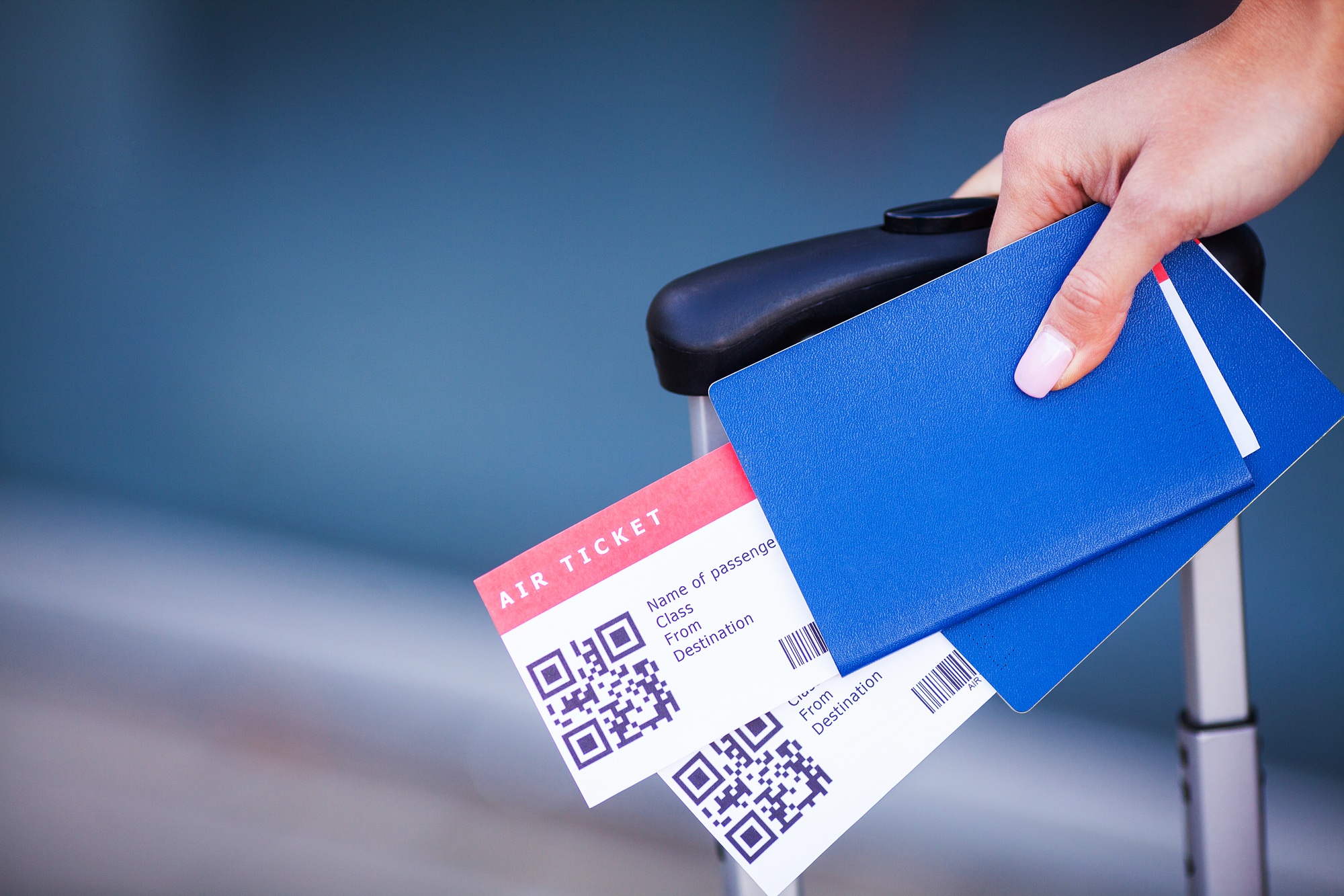 Close up two air ticket in abroad passport near airport